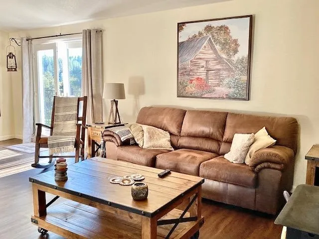 a living room with furniture and a large window