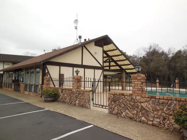 a view of a house with a wooden deck