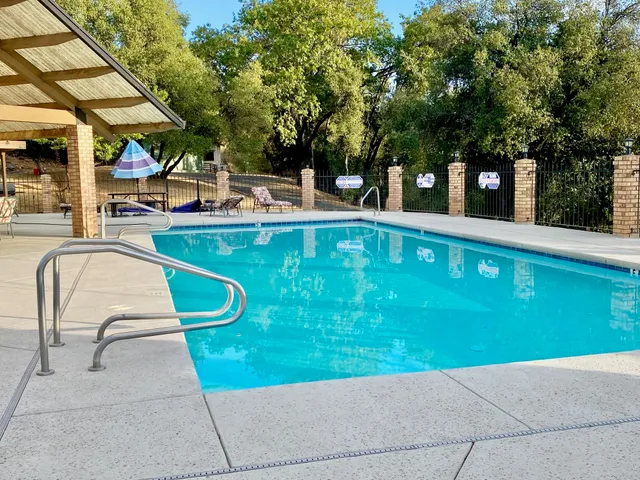 a view of swimming pool with chairs