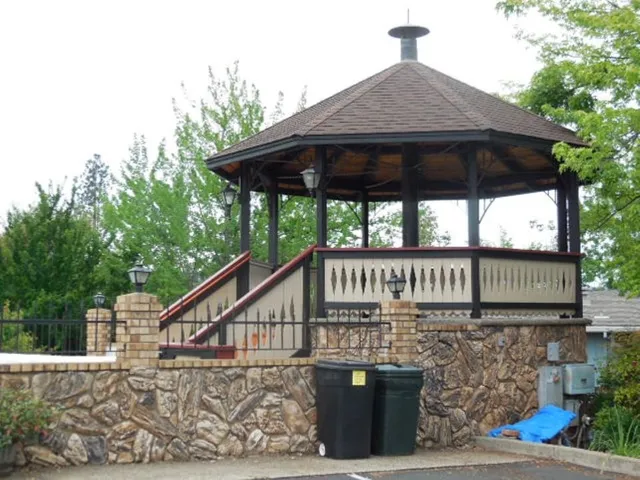 a view of a house with yard and sitting area