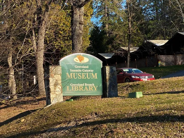 a view of a park with iron fence