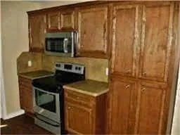 a kitchen with a stove and a microwave