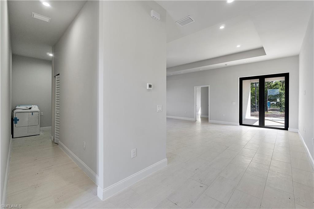 3702 66th Avenue Northeast Naples, FL 34120 - Photo 10 of 10 Hallway with washer / dryer and recessed lighting
