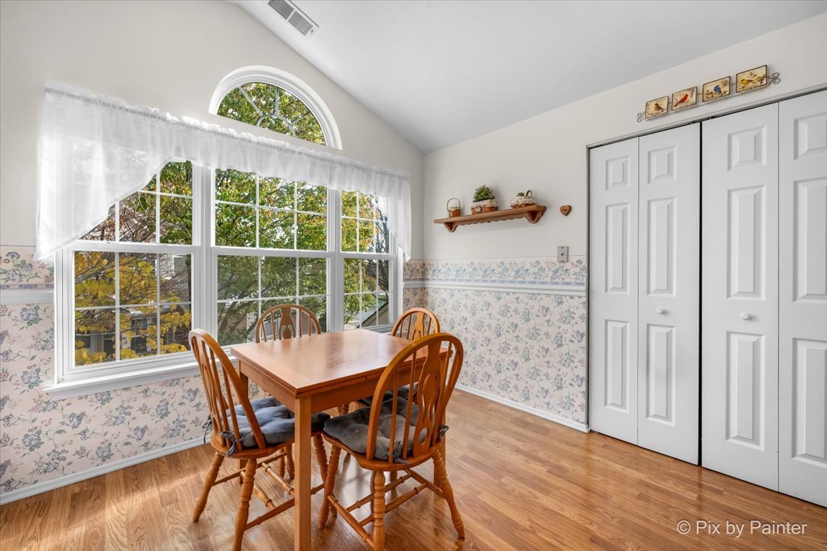 445 Cromwell Circle, Unit 3 Bartlett, IL 60103 - Photo 17 of 37 a view of a dining room with furniture window and wooden floor