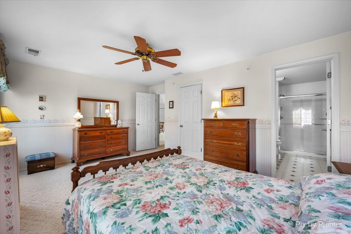 445 Cromwell Circle, Unit 3 Bartlett, IL 60103 - Photo 20 of 37 a bedroom with a bed and furniture