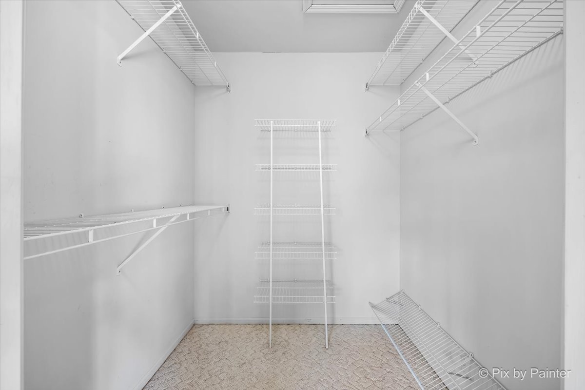 445 Cromwell Circle, Unit 3 Bartlett, IL 60103 - Photo 22 of 37 a view of an empty walk in closet