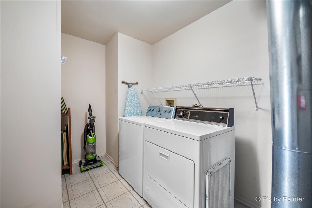 445 Cromwell Circle, Unit 3 Bartlett, IL 60103 - Photo 26 of 37 a utility room with dryer and washer