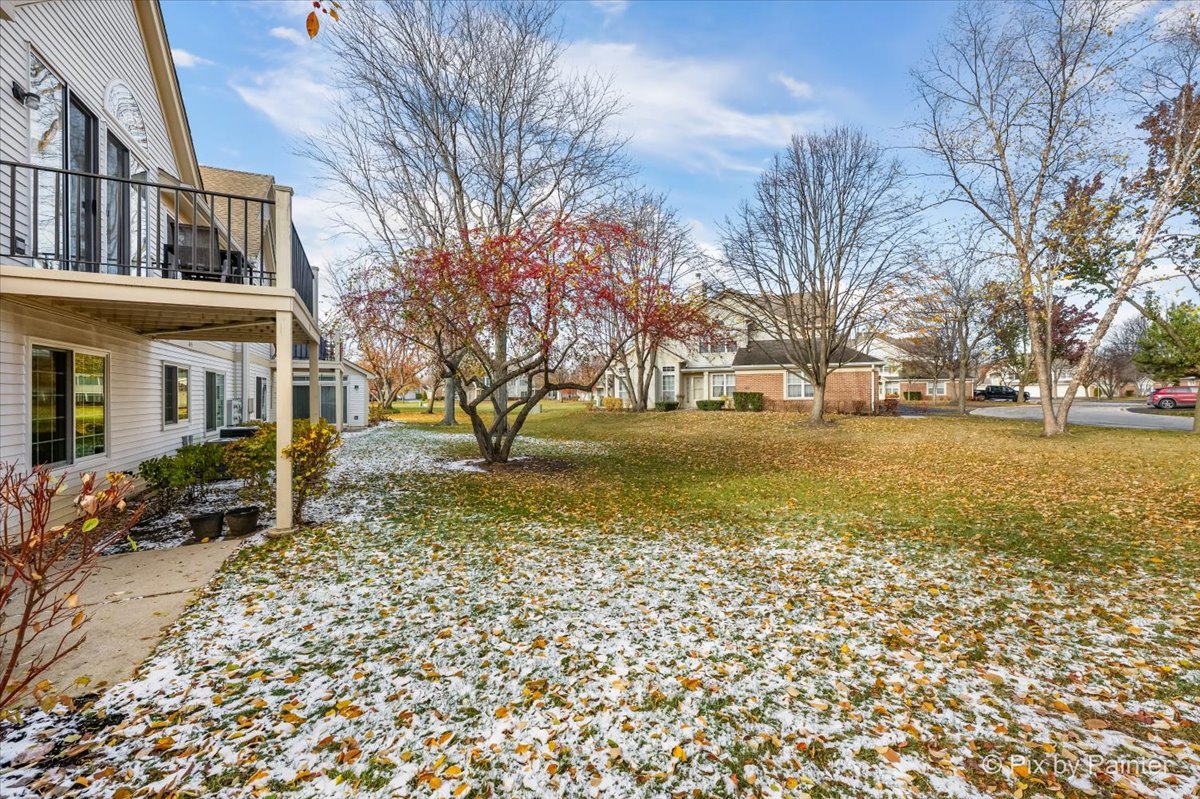 445 Cromwell Circle, Unit 3 Bartlett, IL 60103 - Photo 29 of 37 a view of a yard with a house
