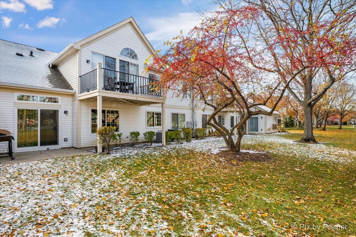 445 Cromwell Circle, Unit 3 Bartlett, IL 60103 - Photo 30 of 37 a front view of a house with a large tree