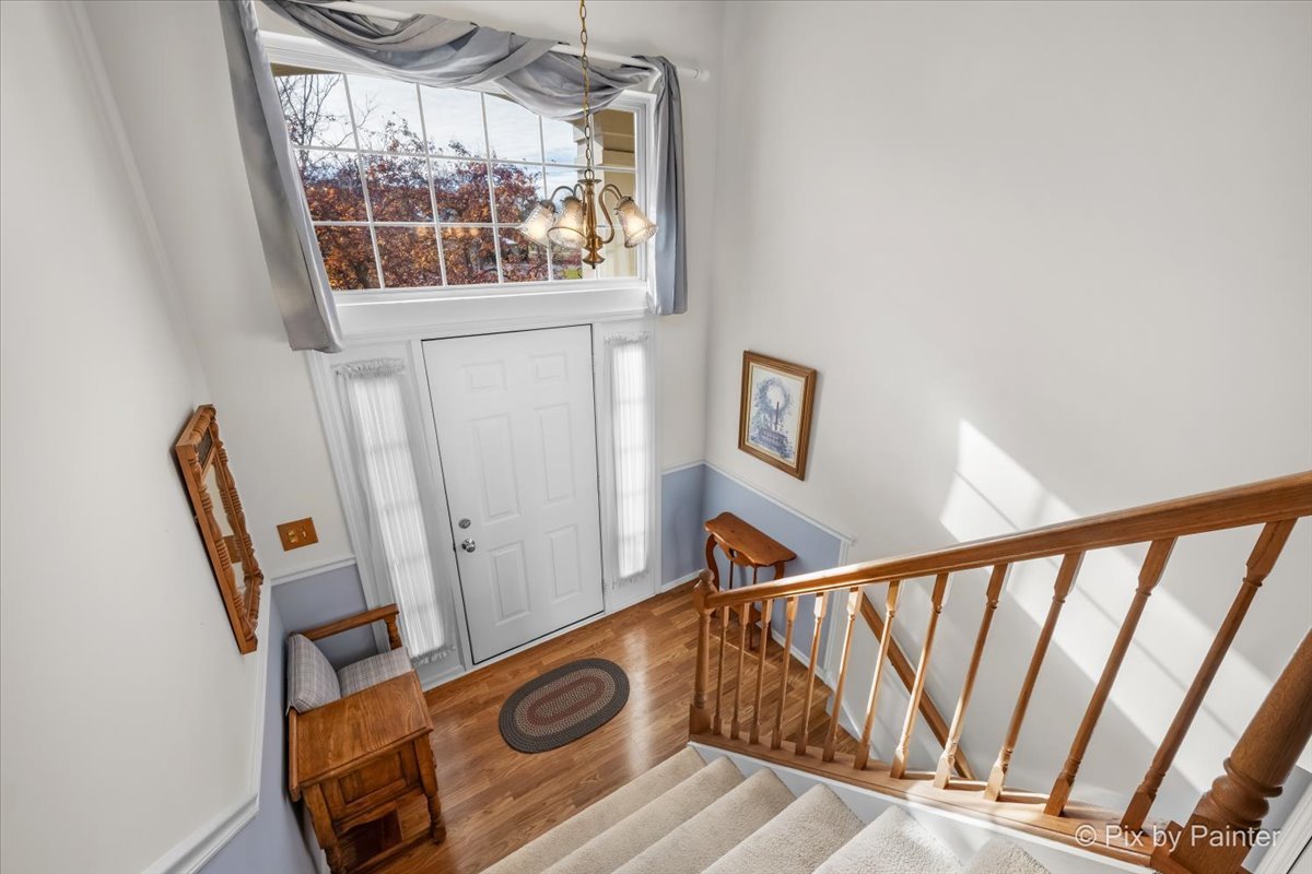 445 Cromwell Circle, Unit 3 Bartlett, IL 60103 - Photo 7 of 37 a view of front door with wooden floor