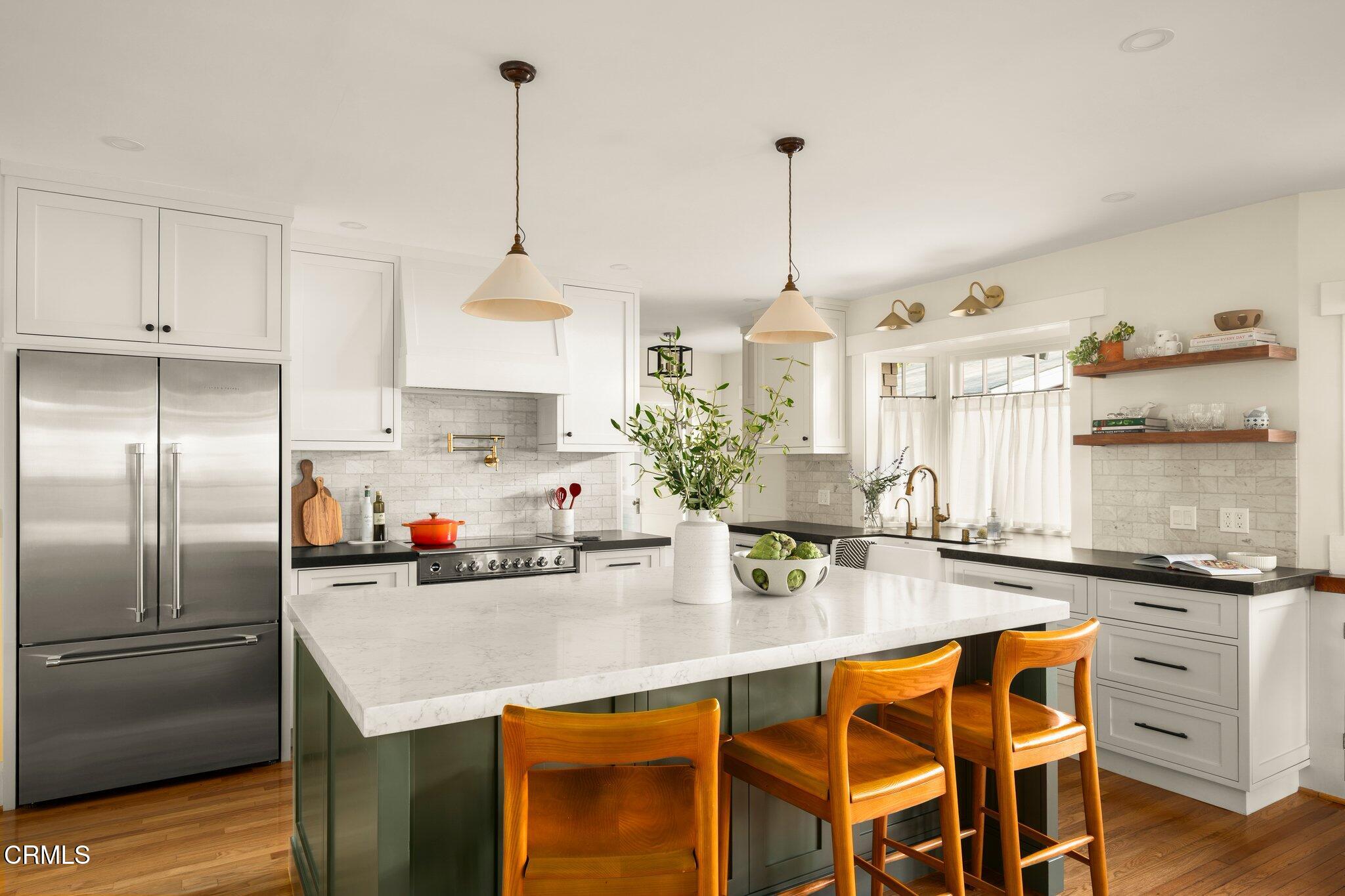 501 Douglas Street Pasadena, CA 91104 - Photo 13 of 36 a kitchen with stainless steel appliances granite countertop a sink a stove and a refrigerator