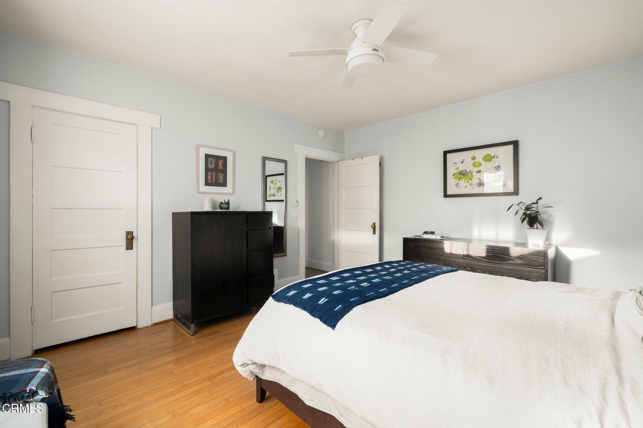 501 Douglas Street Pasadena, CA 91104 - Photo 18 of 36 a bedroom with a bed and a refrigerator