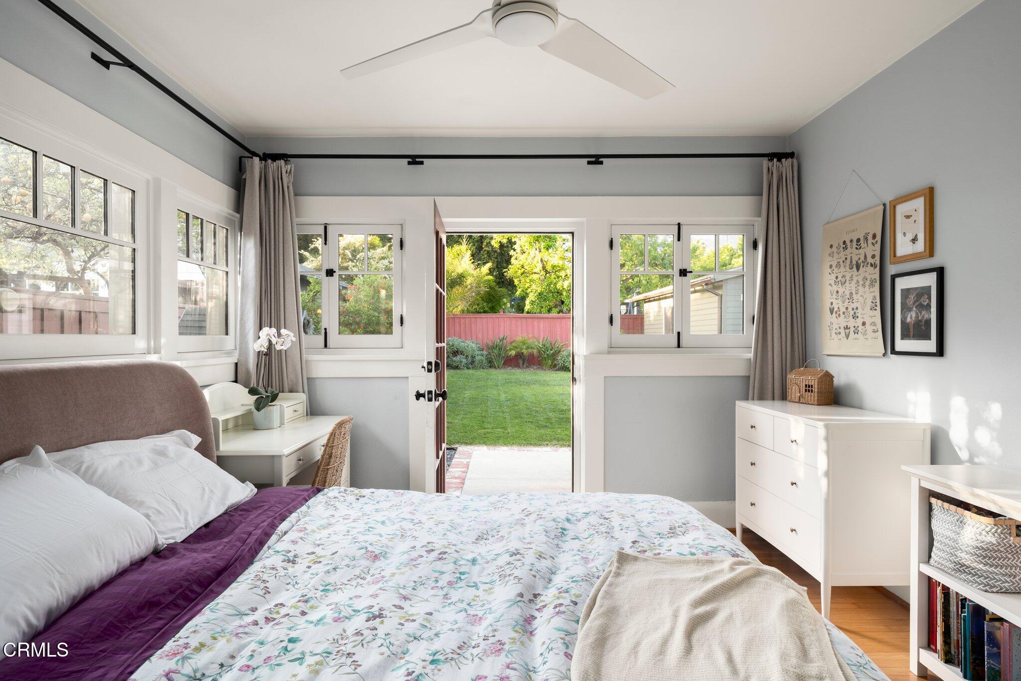 501 Douglas Street Pasadena, CA 91104 - Photo 21 of 36 a bedroom with a bed wooden floor and window