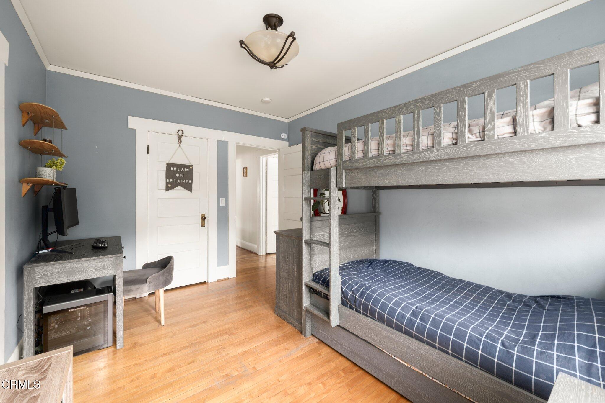 501 Douglas Street Pasadena, CA 91104 - Photo 23 of 36 a bedroom with a bed and a television