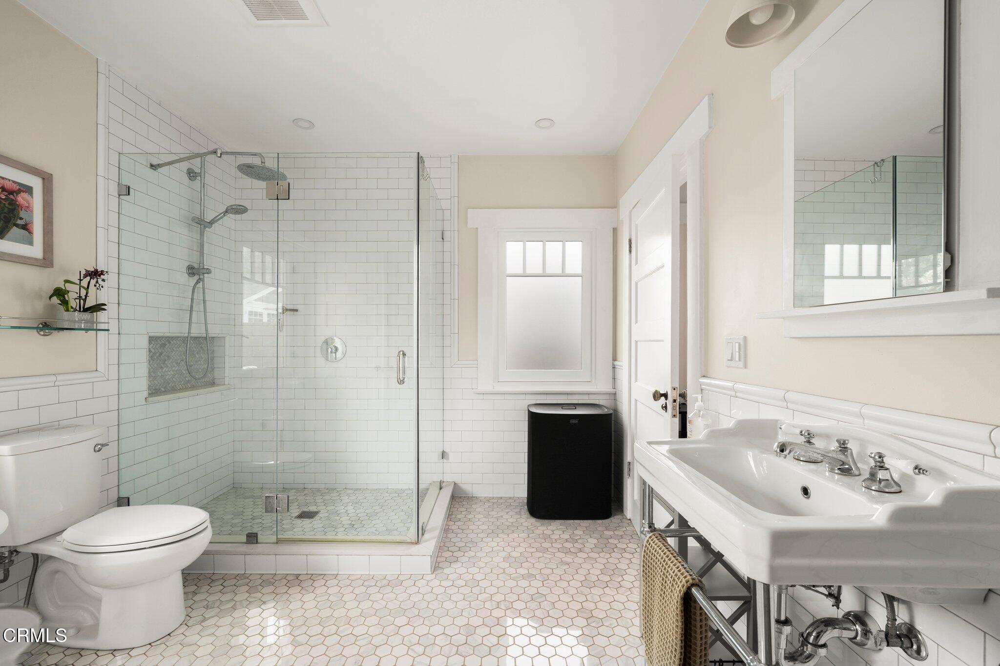 501 Douglas Street Pasadena, CA 91104 - Photo 24 of 36 a bathroom with a sink toilet and shower