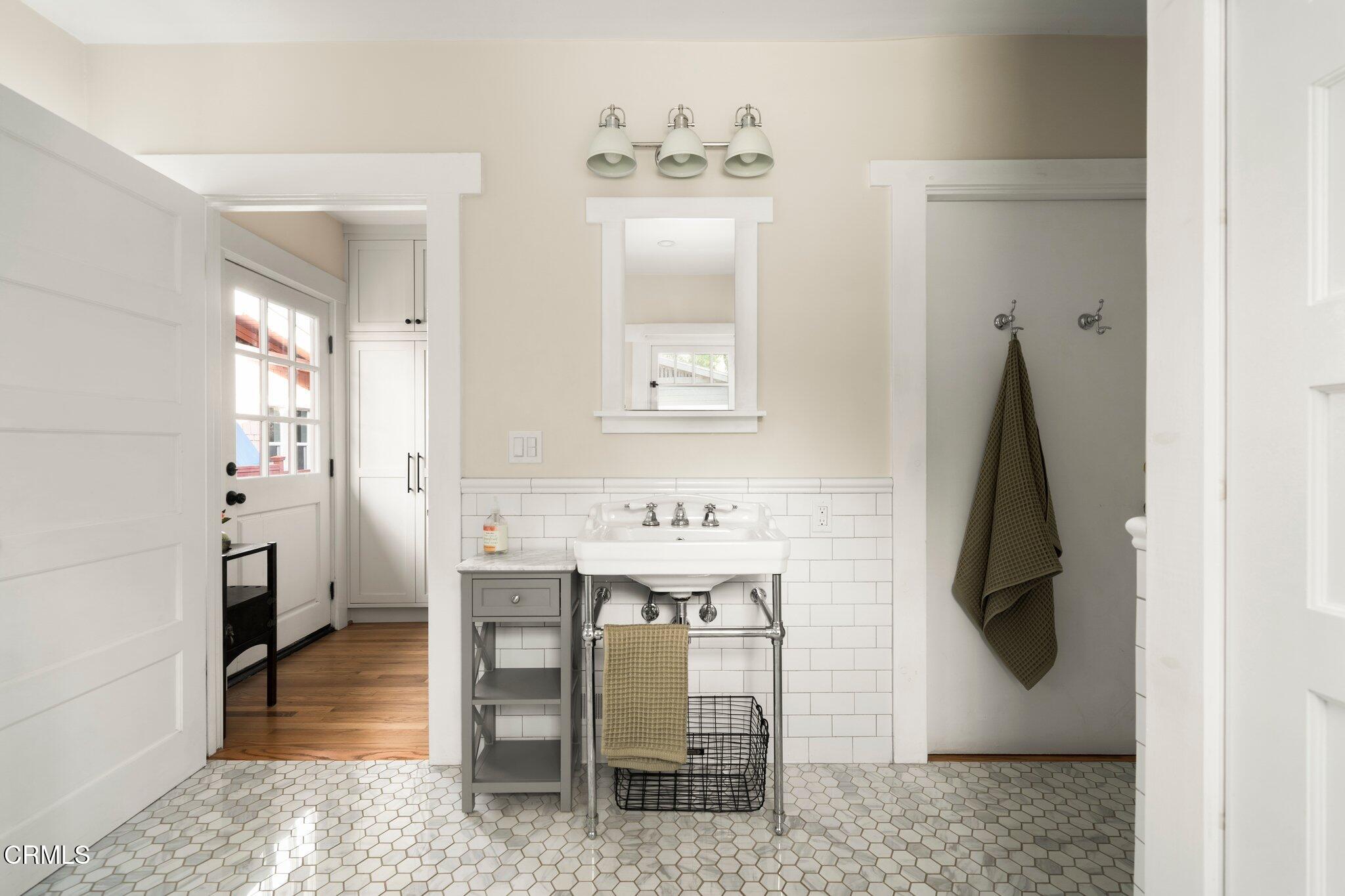 501 Douglas Street Pasadena, CA 91104 - Photo 25 of 36 a bathroom with a sink and mirror