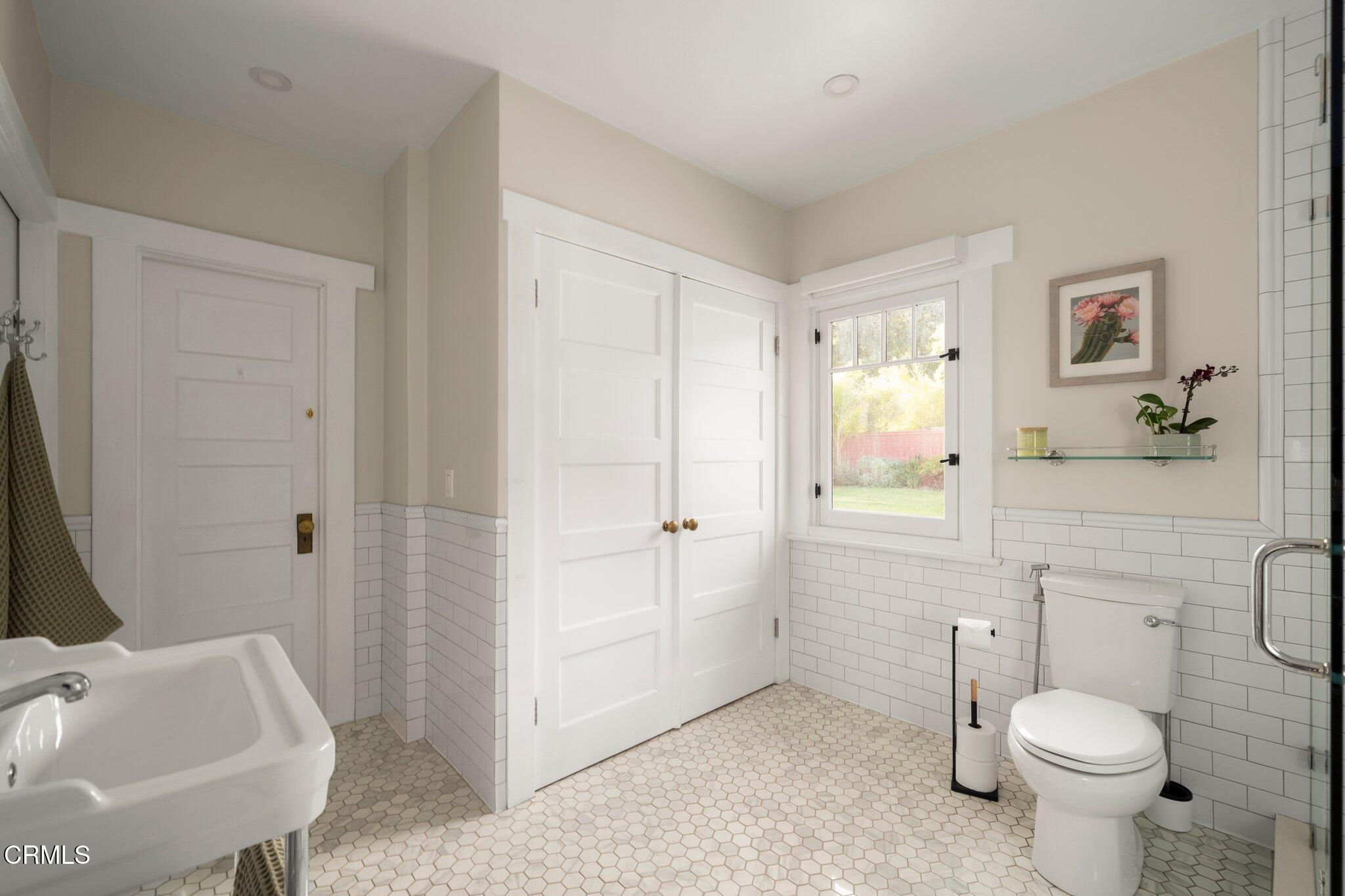 501 Douglas Street Pasadena, CA 91104 - Photo 26 of 36 a bathroom with a sink a toilet and shower