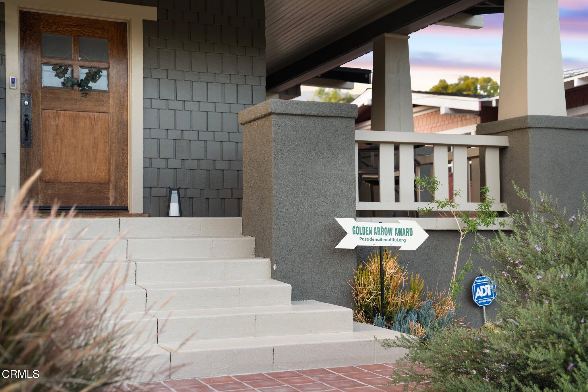501 Douglas Street Pasadena, CA 91104 - Photo 3 of 36 a view of a patio with table and chairs and potted plants