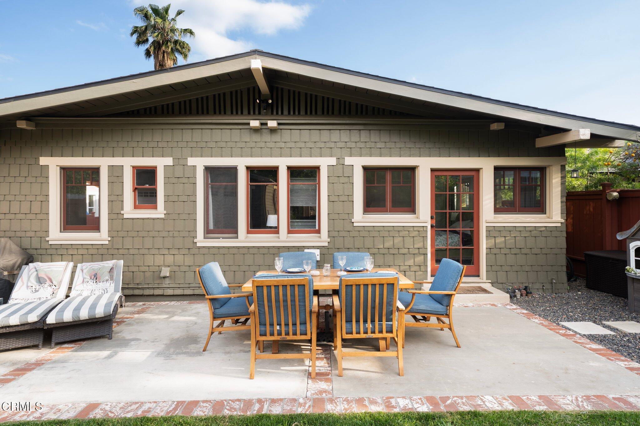 501 Douglas Street Pasadena, CA 91104 - Photo 31 of 36 a view of a patio with a table and chairs and floor to ceiling window