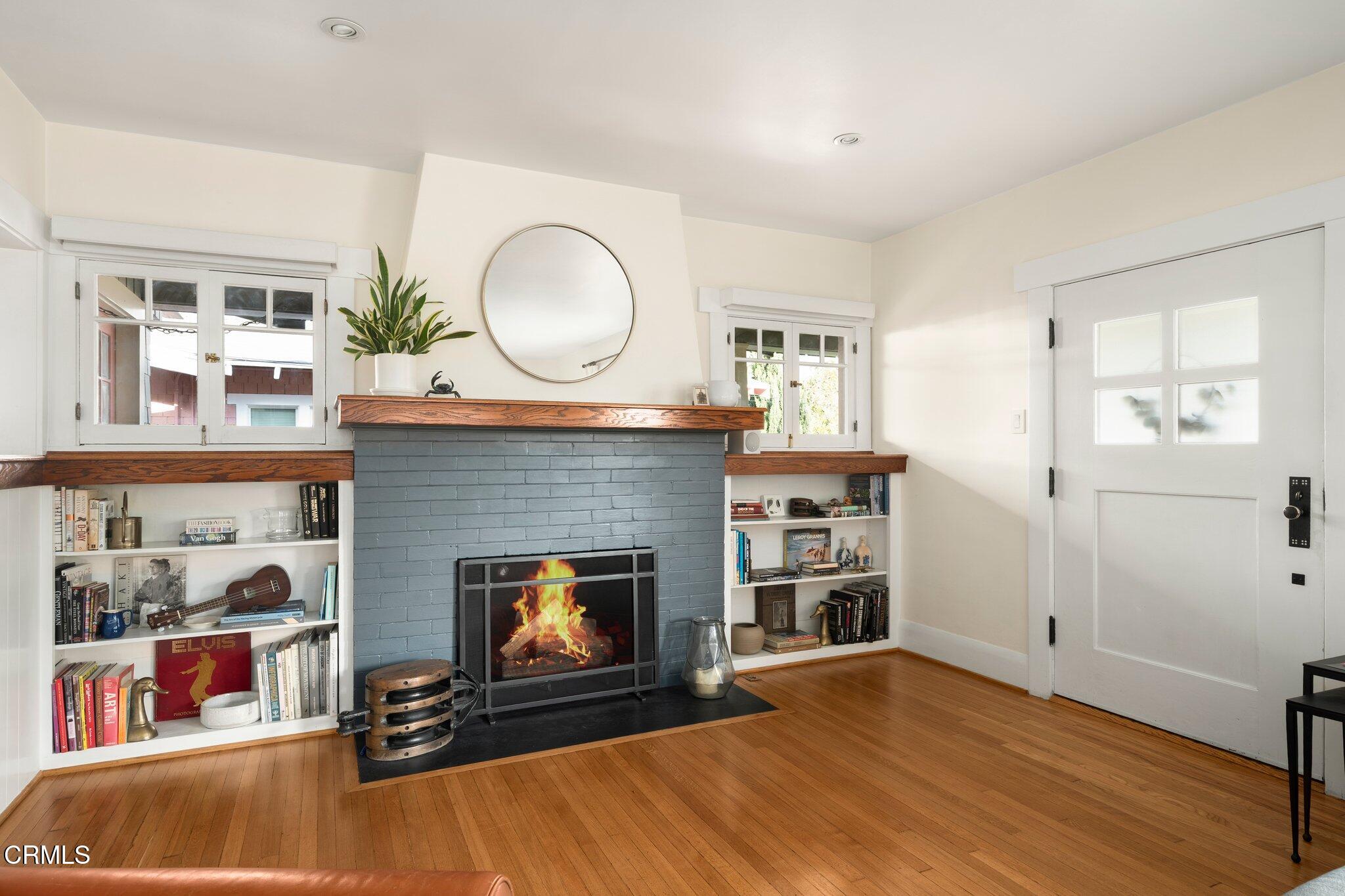 501 Douglas Street Pasadena, CA 91104 - Photo 6 of 36 a living room with furniture and a fireplace