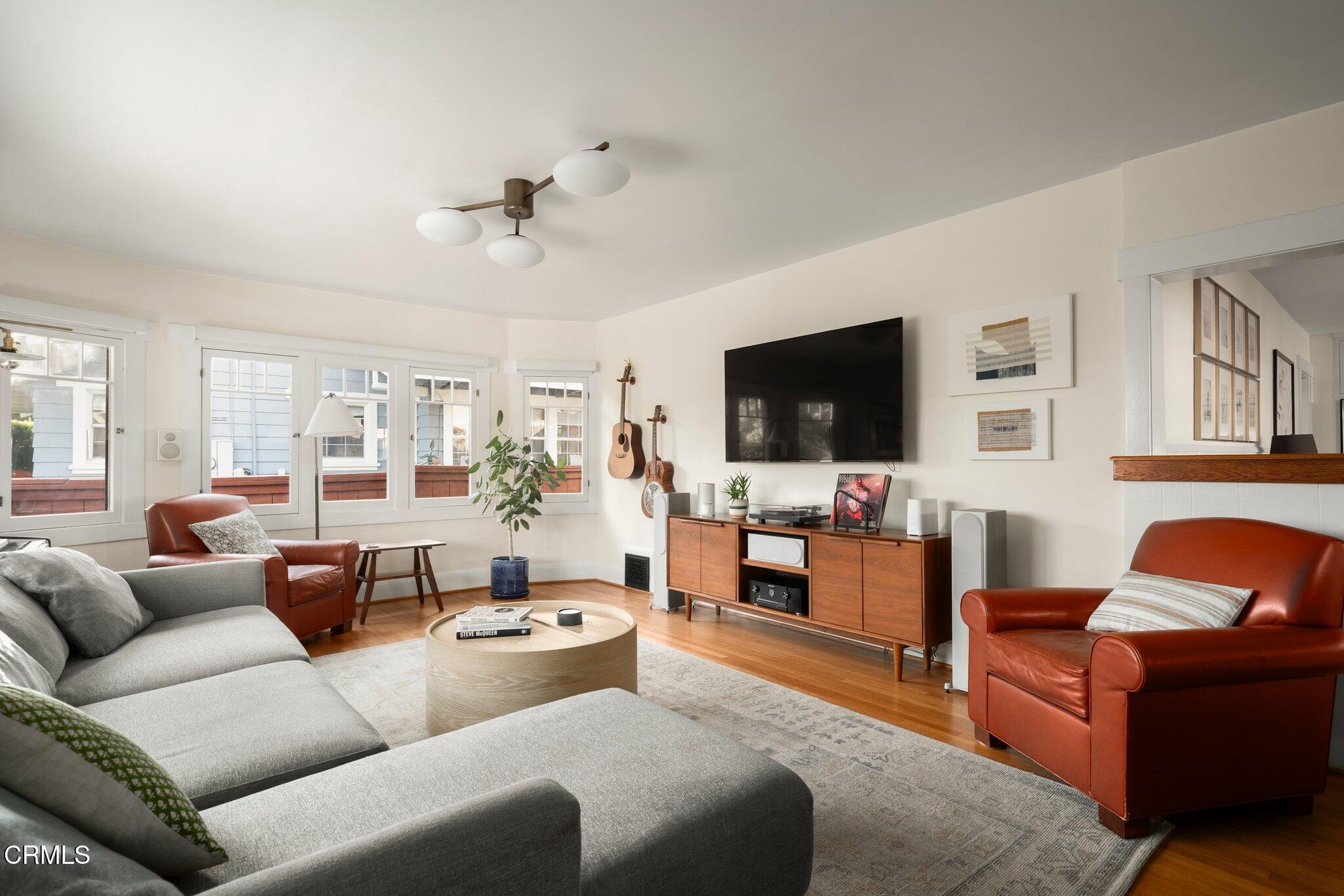 501 Douglas Street Pasadena, CA 91104 - Photo 7 of 36 a living room with furniture and a flat screen tv