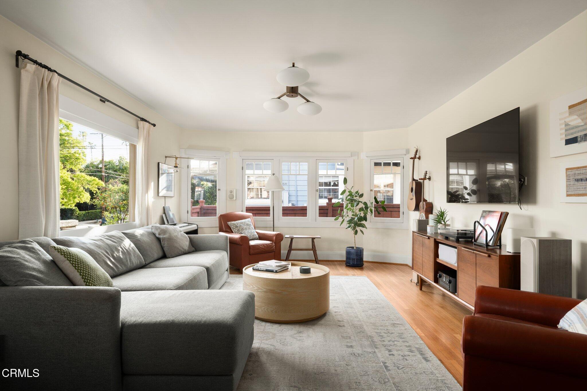 501 Douglas Street Pasadena, CA 91104 - Photo 8 of 36 a living room with furniture flat screen tv and windows