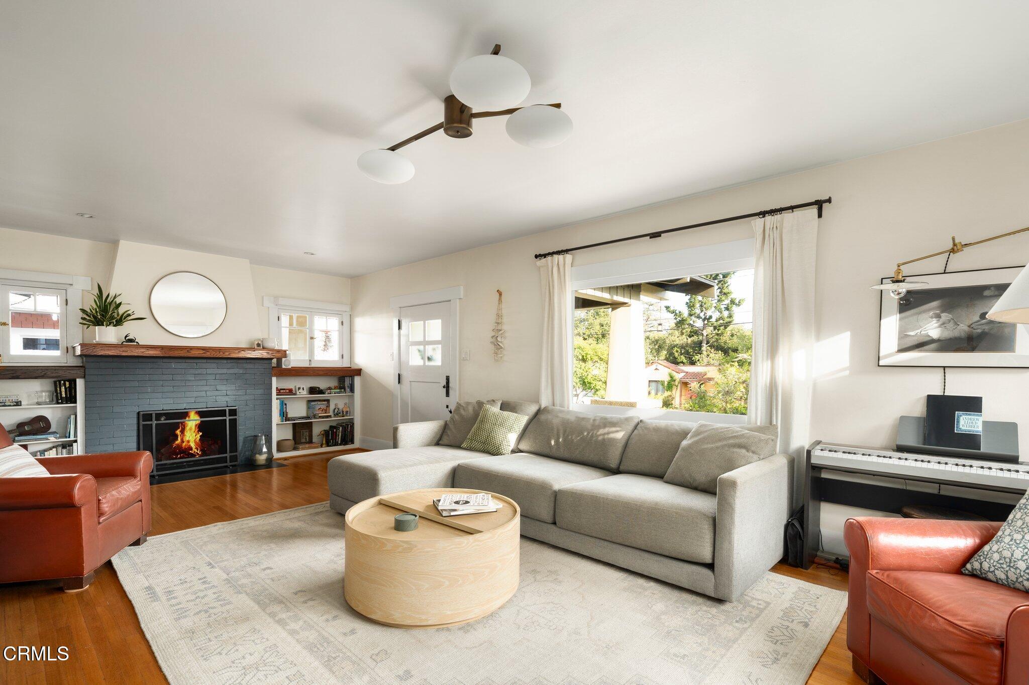 501 Douglas Street Pasadena, CA 91104 - Photo 9 of 36 a living room with furniture and a fireplace