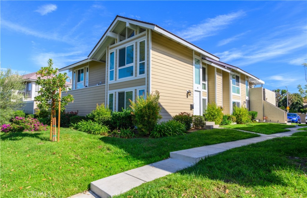 51 Oval Road, Unit 1 Irvine, CA 92604 - Photo 1 of 1 a front view of a house with a yard