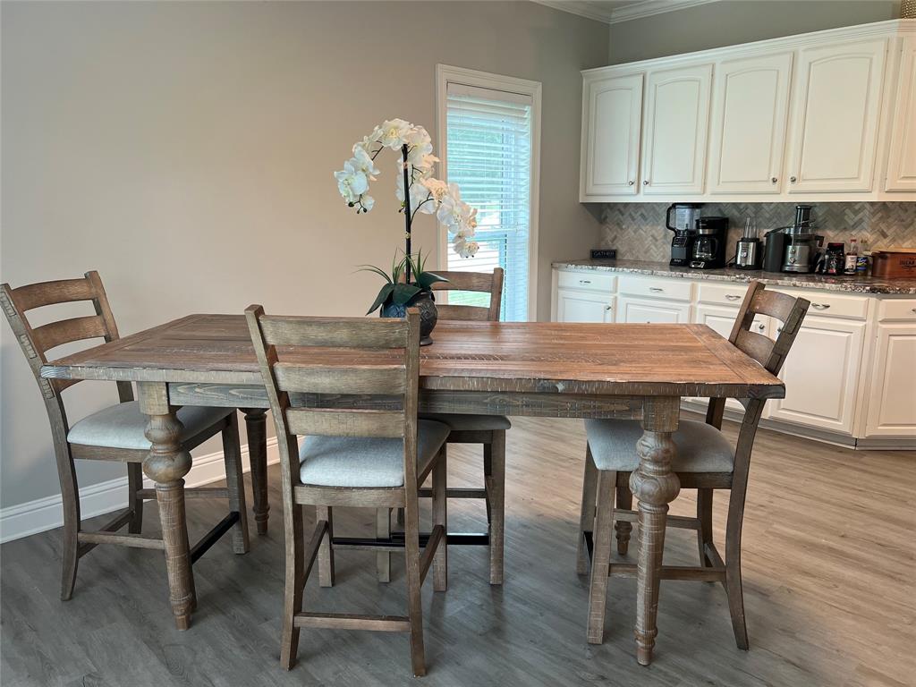 5270 Quad J Road Shreveport, LA 71107 - Photo 9 of 18 a view of a dining room with furniture and wooden floor