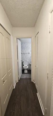 a view of a livingroom from a hallway