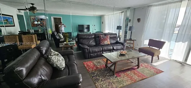 a living room with furniture and a rug