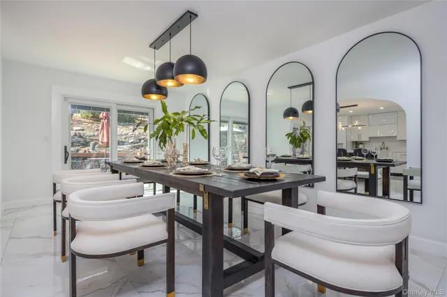 a kitchen with a dining table and chairs