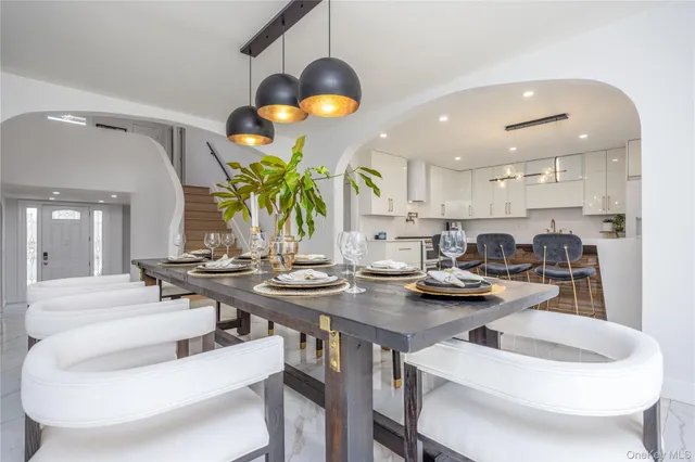 a kitchen with a table and chairs