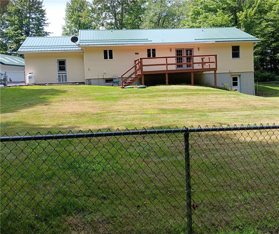 4931 Devlen Road Locke, NY 13092 - Photo 21 of 24 Back view of House and fenced in yard