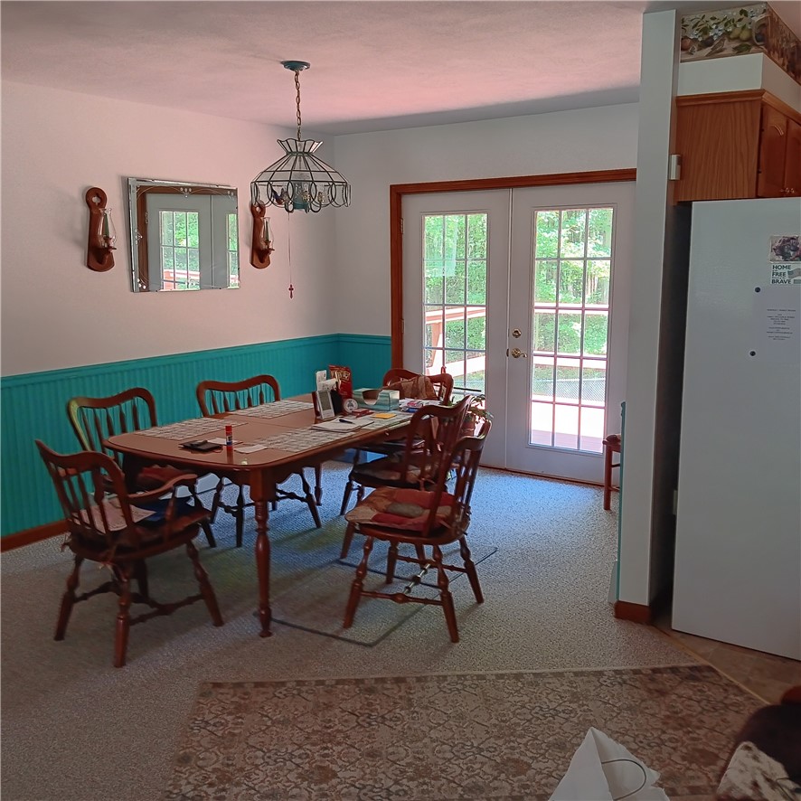 4931 Devlen Road Locke, NY 13092 - Photo 5 of 24 Dining room looks over deck and back yard
