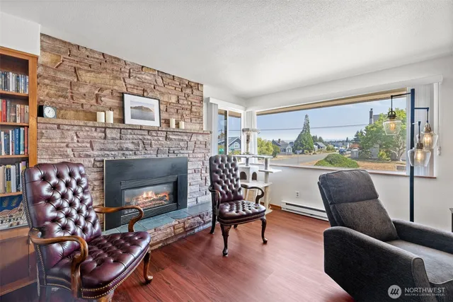 a view of a dining room with furniture window and wooden floor