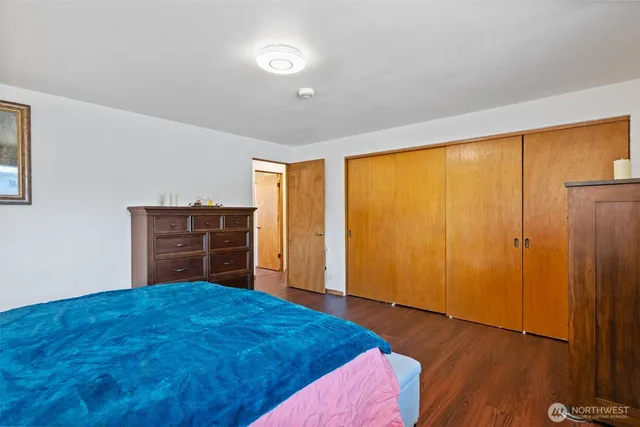 a view of a livingroom with workspace and a couch