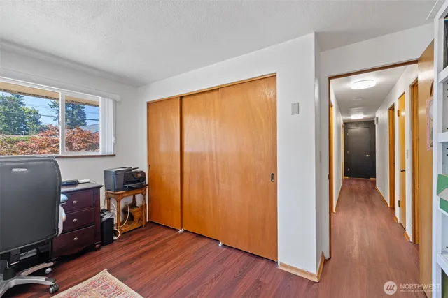 a bathroom with a sink mirror toilet and window