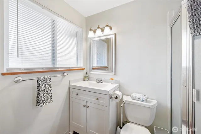 a bathroom with a shower and a toilet