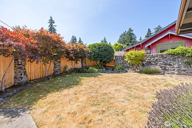 a view of a house with wooden fence