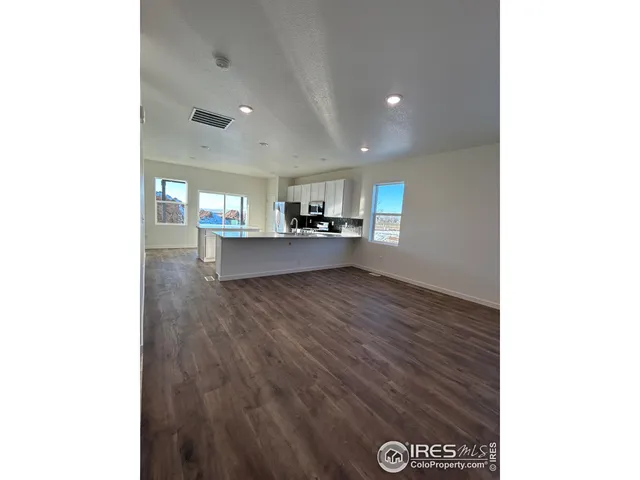 a view of a kitchen and window