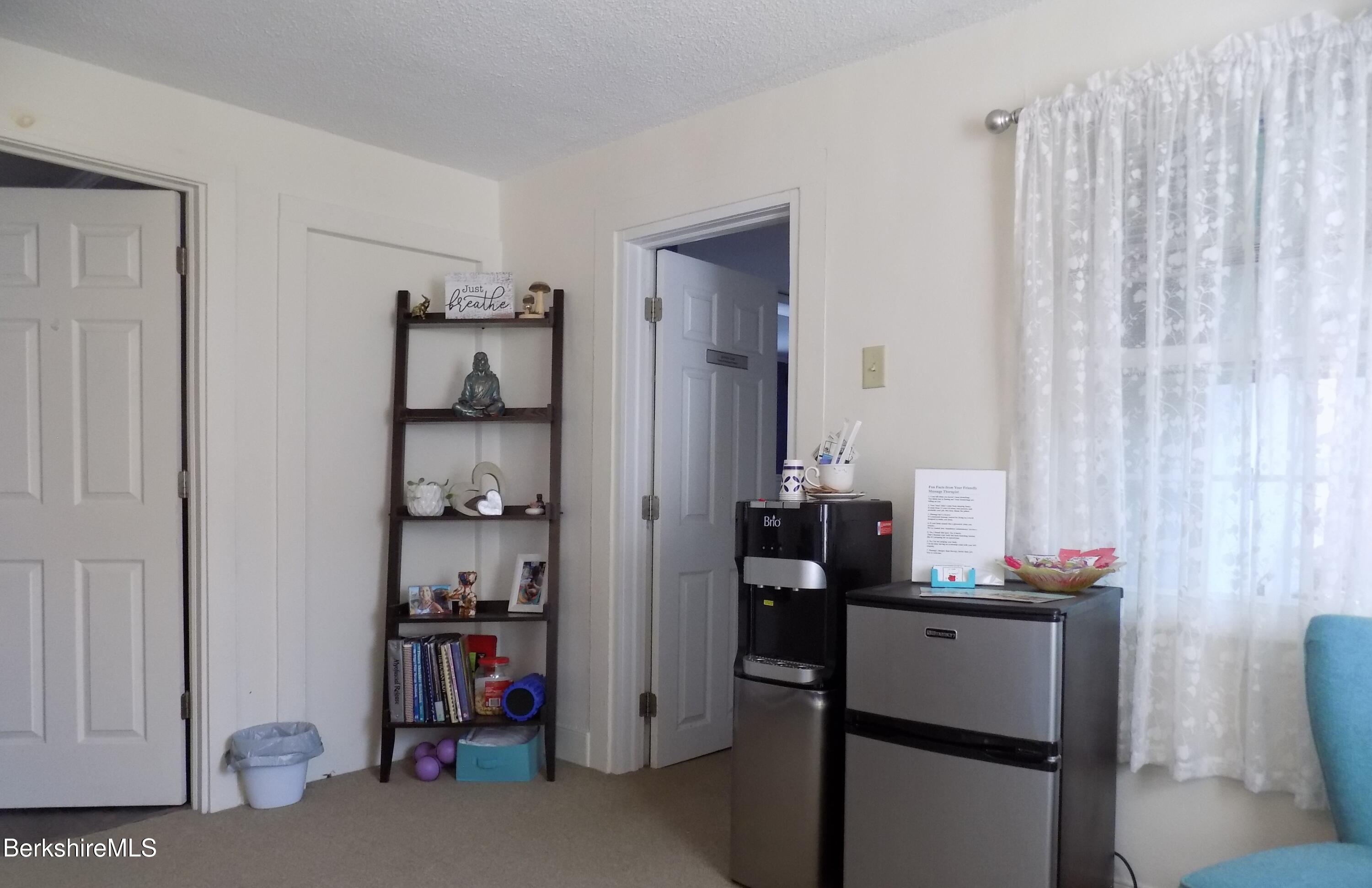 208 Main Street Lee, MA 01238 - Photo 14 of 29 a bathroom with a sink and a mirror