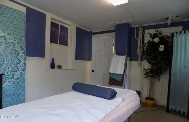 a view of balcony with wooden floor and outdoor seating