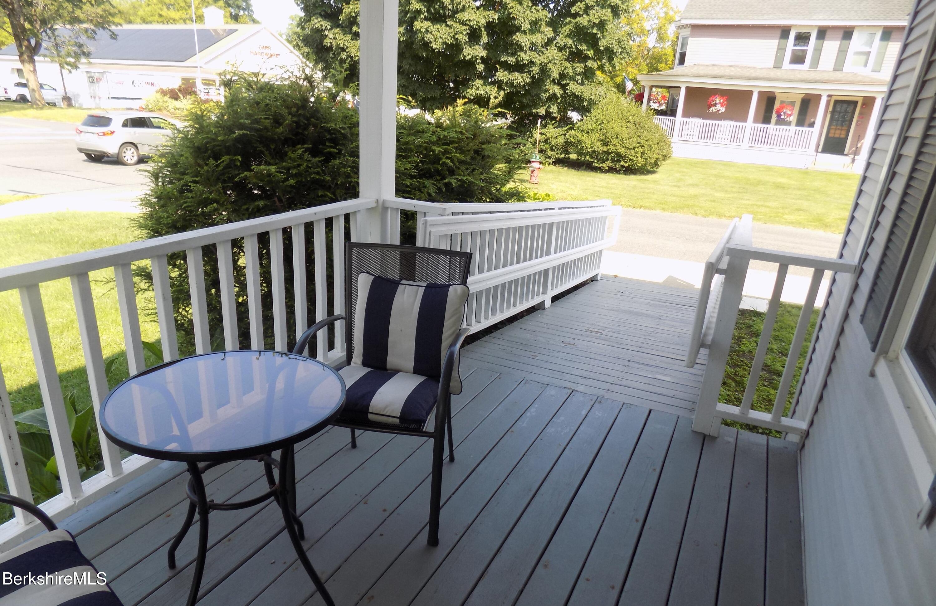 208 Main Street Lee, MA 01238 - Photo 19 of 29 a view of balcony with wooden floor and outdoor seating