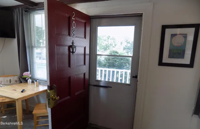 a bathroom with a sink vanity and a mirror