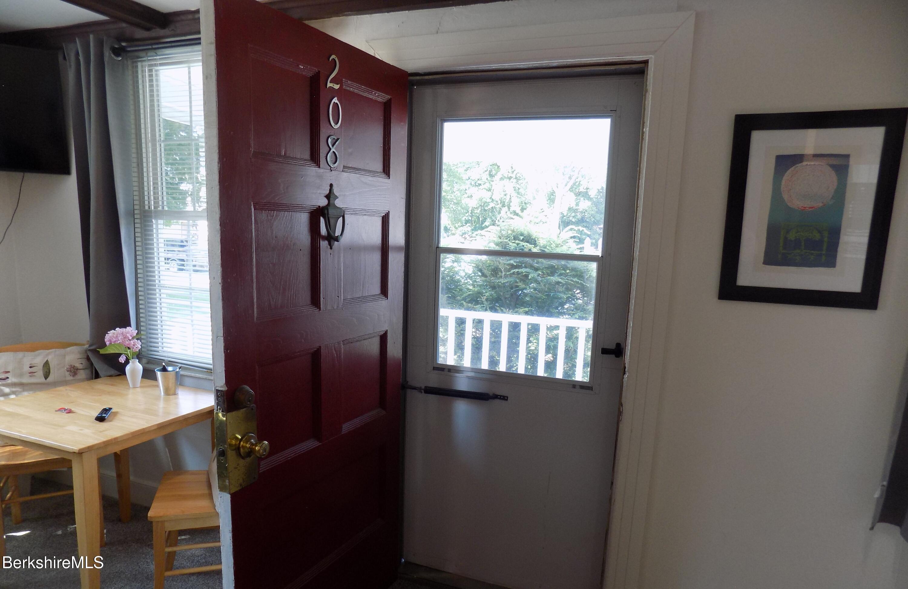208 Main Street Lee, MA 01238 - Photo 2 of 29 a bathroom with a sink vanity and a mirror