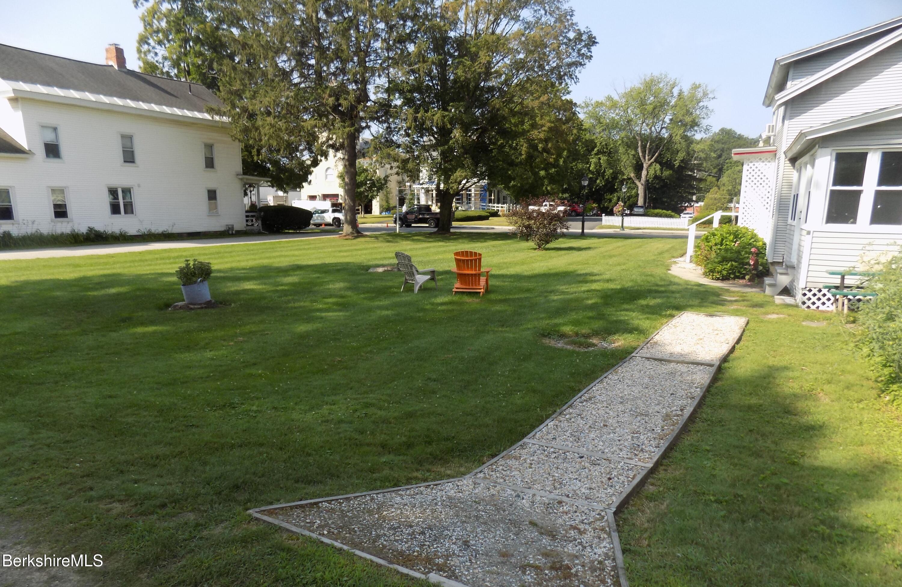 208 Main Street Lee, MA 01238 - Photo 25 of 29 a view of a backyard with a garden