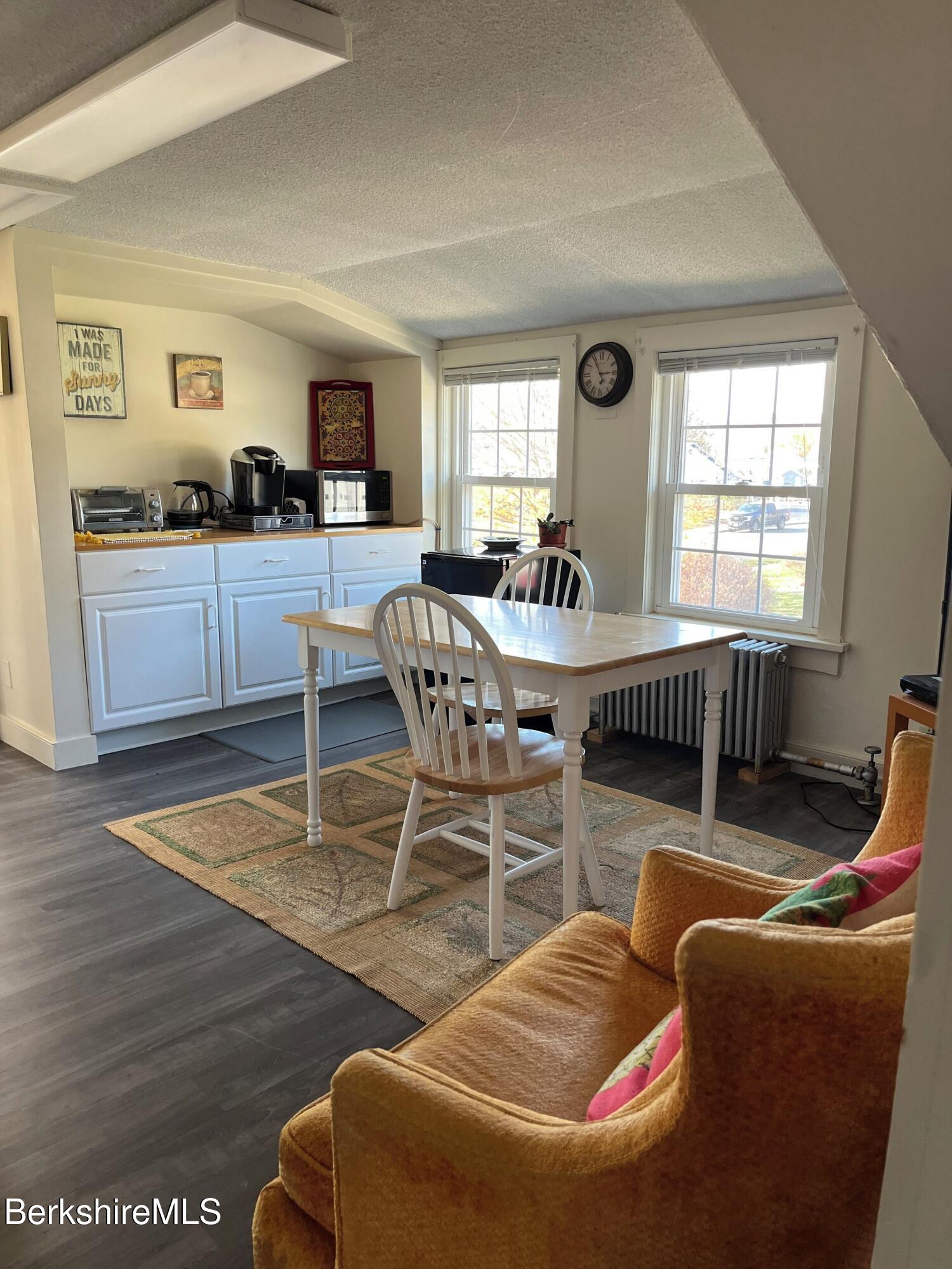 208 Main Street Lee, MA 01238 - Photo 8 of 29 a living room with furniture and wooden floor