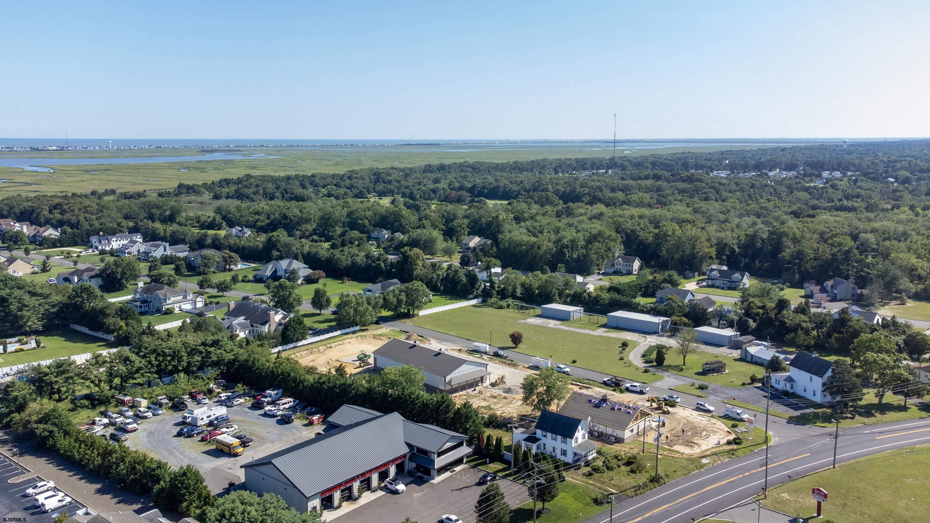 1233 Highway 9 Ocean View, NJ 08230 - Photo 5 of 33 an aerial view of a swimming pool yard and mountain view in back