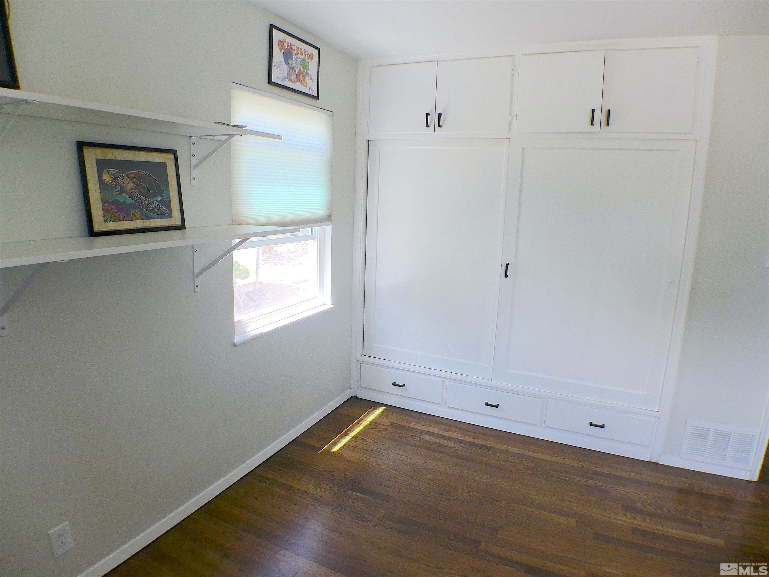 925 Yori Avenue Reno, NV 89502 - Photo 17 of 20 a view of a small space with wooden floor and windows